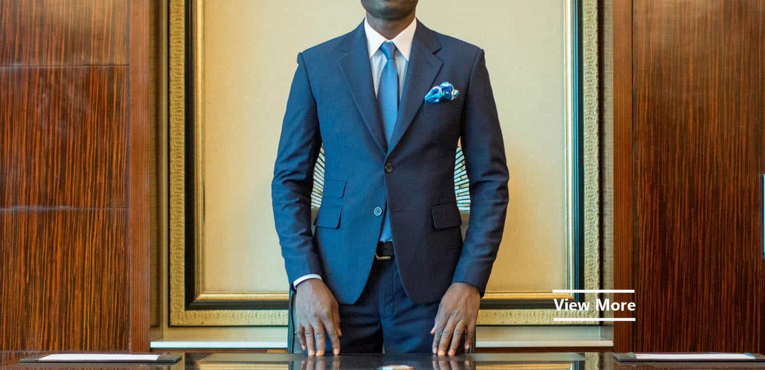 Bespoke blue suit by Ghanaian tailor Adjei Anang