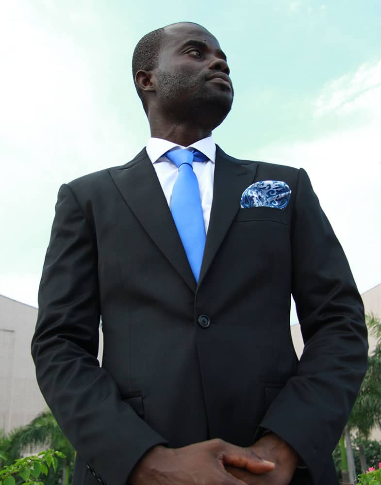 bespoke black suit by Ghanaian tailor Adjei Anang
