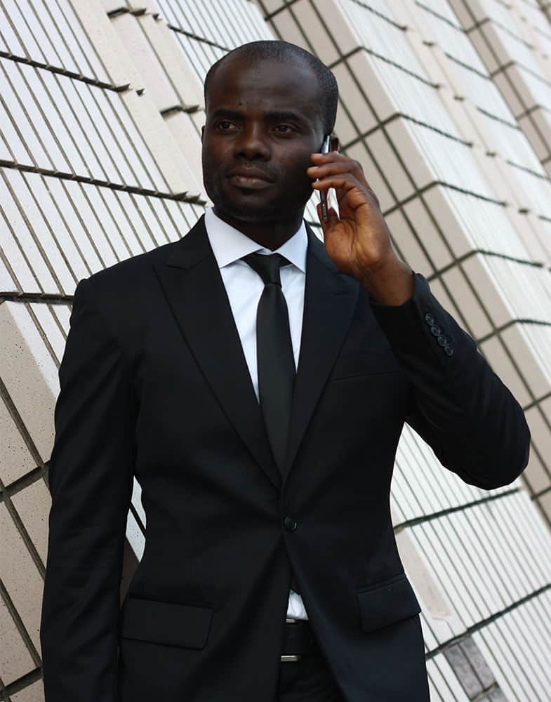 Tailor-made black suit by Ghanaian tailor Adjei Anang