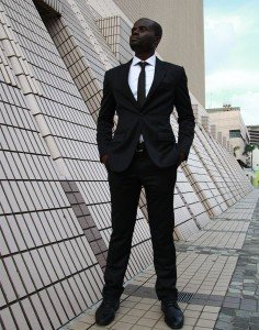 Tailor-made black suit by Ghanaian tailor Adjei Anang