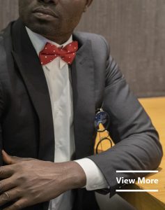 Tailored men's black suits by Ghanaian tailor, Adjei Anang