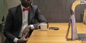Tailored made men's black suit by Ghanaian tailor, Adjei Anang
