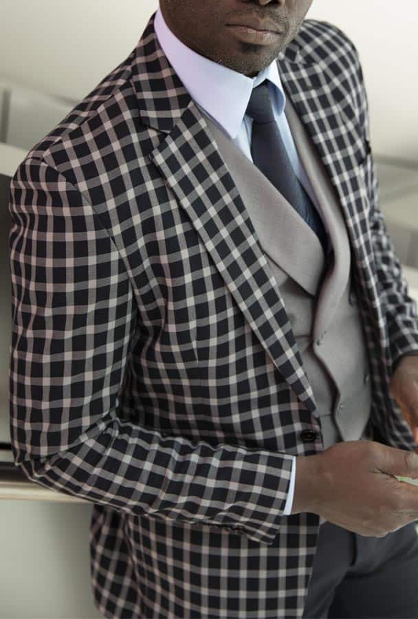 Custom-made three-piece men's checked blue suit by Ghanaian tailor in Accra