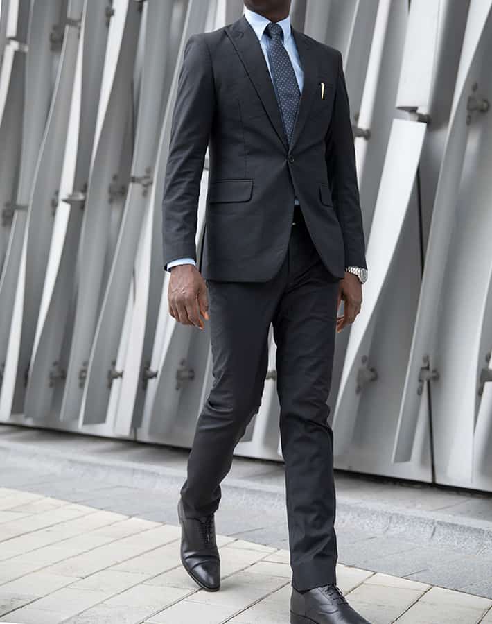tailored made black suit by Ghanaian tailor, Adjei Anang