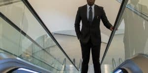 custom made black suit by Ghanaian tailor, Adjei Anang