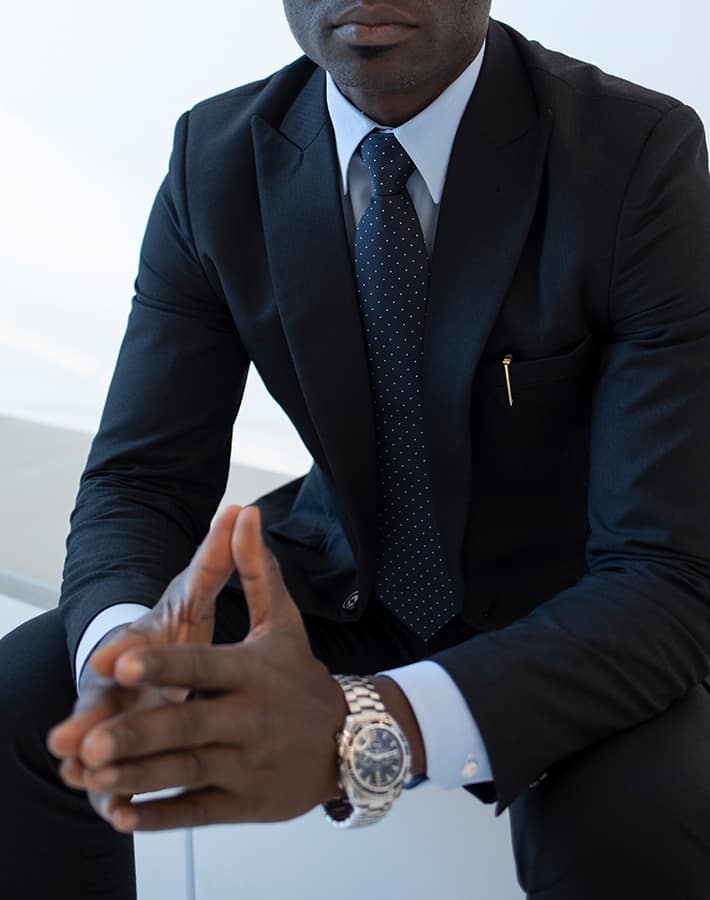 tailored made black suit by Ghanaian tailor, Adjei Anang