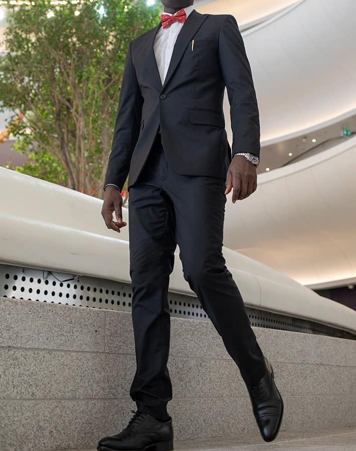 custom made black suit by Ghanaian tailor, Adjei Anang