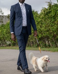 custom made blue suit with polka dot shirt by Ghanaian tailor