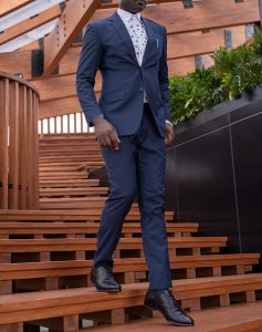 custom made blue suit with polka dot shirt by Ghanaian tailor