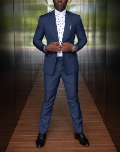 custom made blue suit with polka dot shirt by Ghanaian tailor
