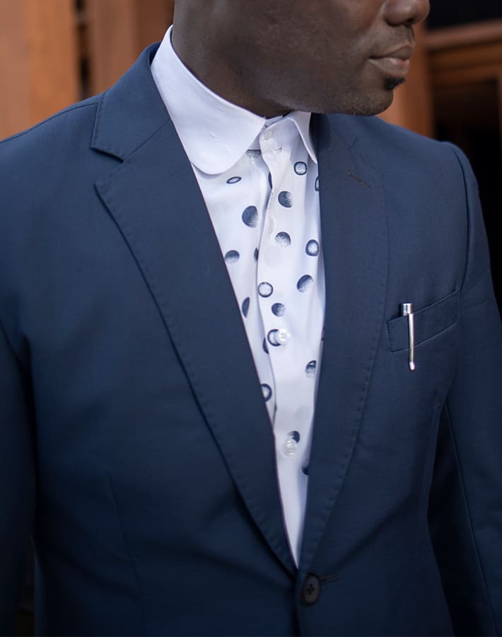 custom made blue suit with polka dot shirt by Ghanaian tailor