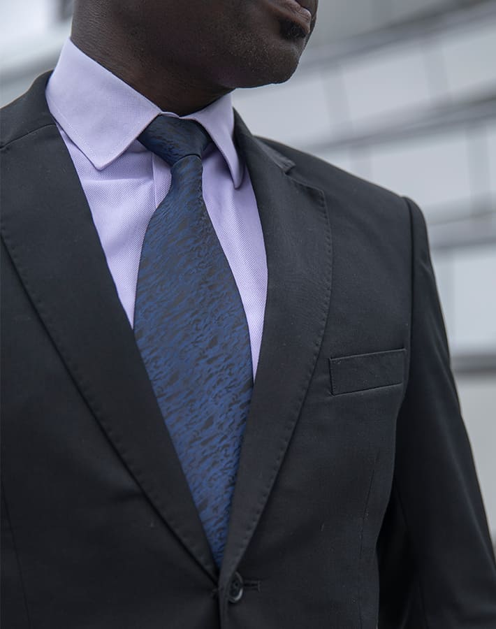custom made black suit by Ghanaian tailor